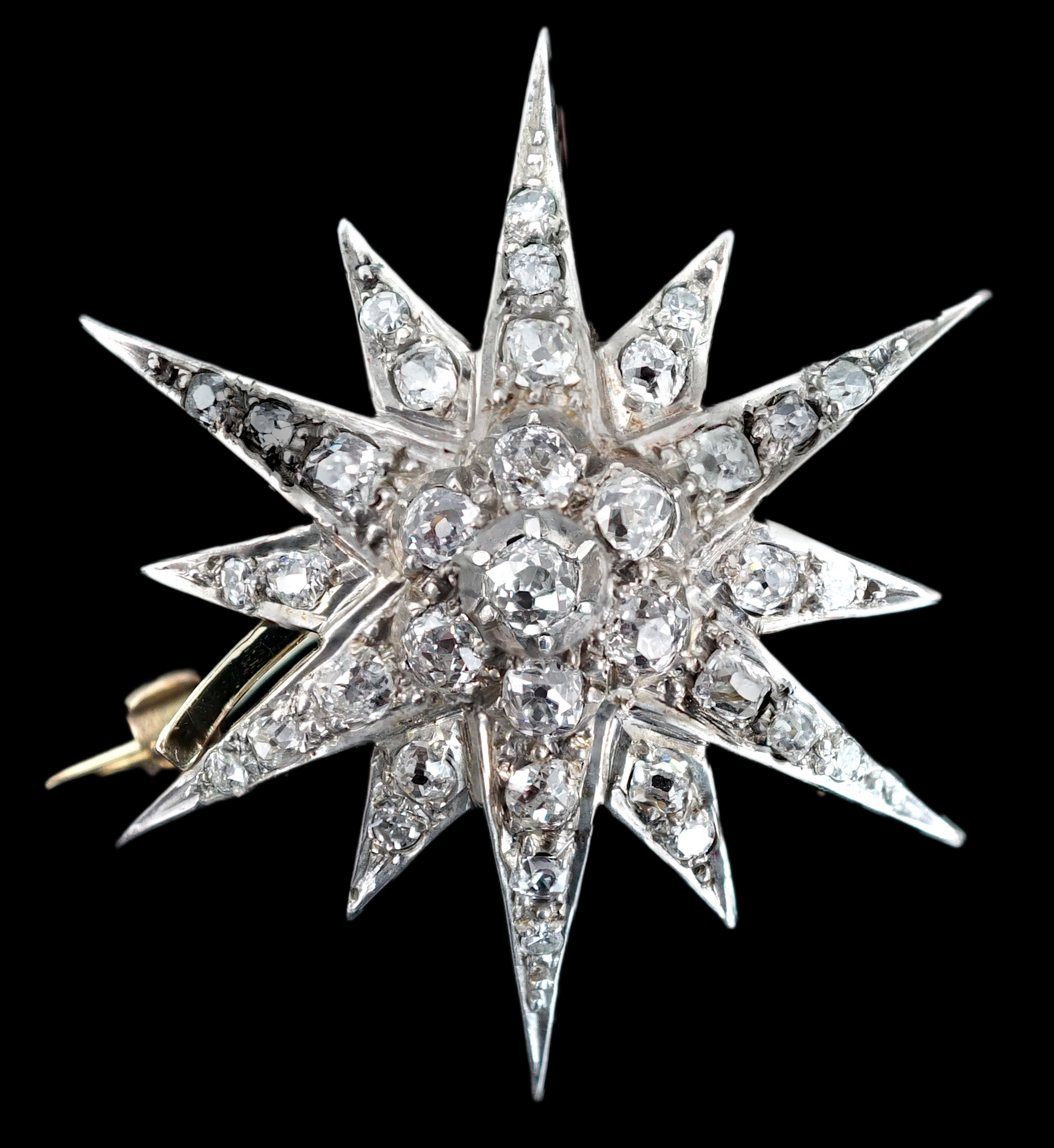 A Victorian gold, silver and graduated diamond cluster starburst brooch